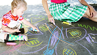 Gabriel playing with chalk