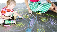 Gabriel playing with chalk