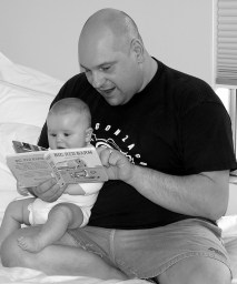Father reading to baby