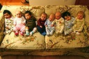 Newborns on a floral sofa